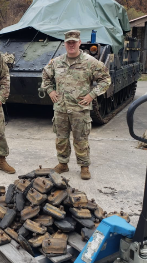 SPC Timms in the motor pool