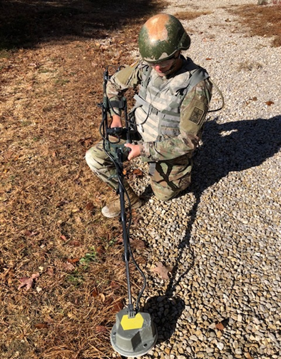 Soldier with mine detector